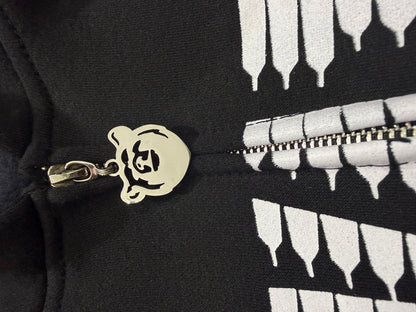 Close-up of Elevators Hoodie zipper featuring a custom chrome bear-shaped pull tab.