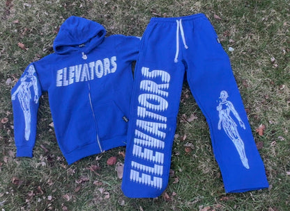 Elevators Hoodie and matching pants set on grass, promoting motivational lifestyle and comfort. Elevators Hoodie.