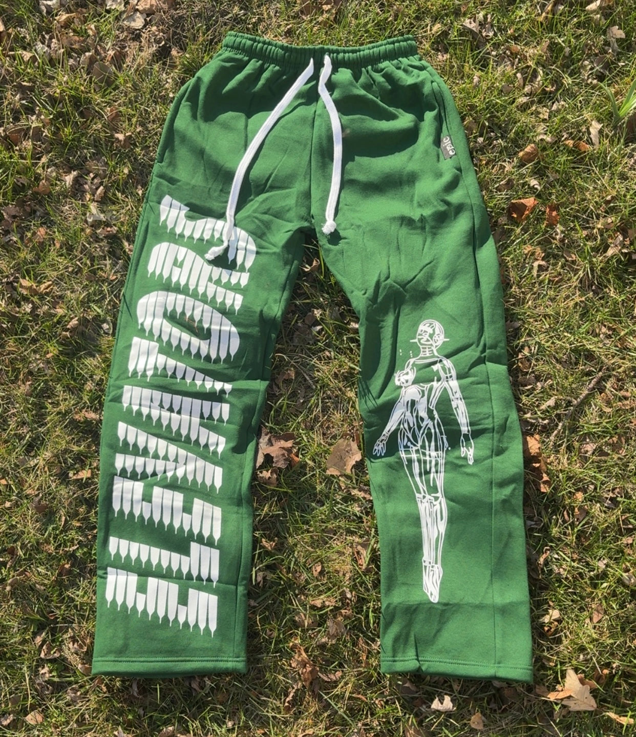 Elevators Joggers in green with white print and drawstring, perfect for elevating style and comfort.